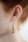 Preview: Im Inneren der zuckersüßen Erbsenschoten Ohrhänger aus handpatinierter Bronze von Michael Michaud liegen leuchtend zwei wunderschöne Perlen. Die Ohrringe warten schon im Perlenmarkt OnlineShop auf Dich! Jetzt entdecken und versandkostenfrei bestellen!